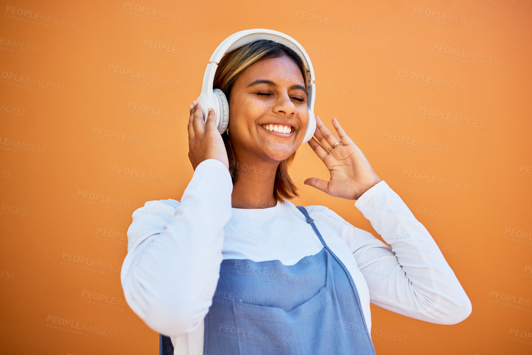 Buy stock photo Mockup, wall and black woman with headphones, smile and streaming music against studio background. African American female, girl and headset for audio, relax and listen to radio, songs and podcast
