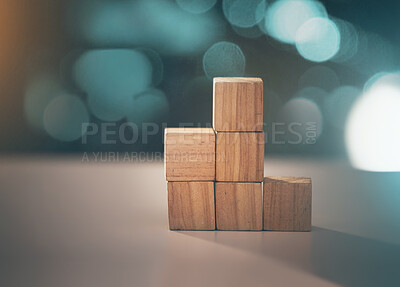 Buy stock photo Building, business and blocks for investment, finance and growth on a table. Accounting, education and conceptual structure for profit, planning and investing in steps for progress on a desk