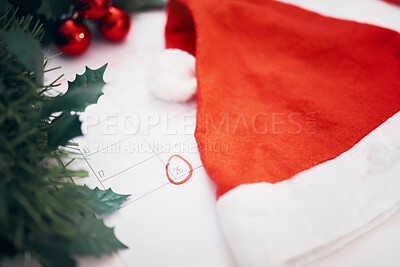 Buy stock photo Christmas, preparation and calendar with decorations for the holiday, planning and celebration of an event. Hat, festive and a planner with an important date for xmas, countdown and tradition