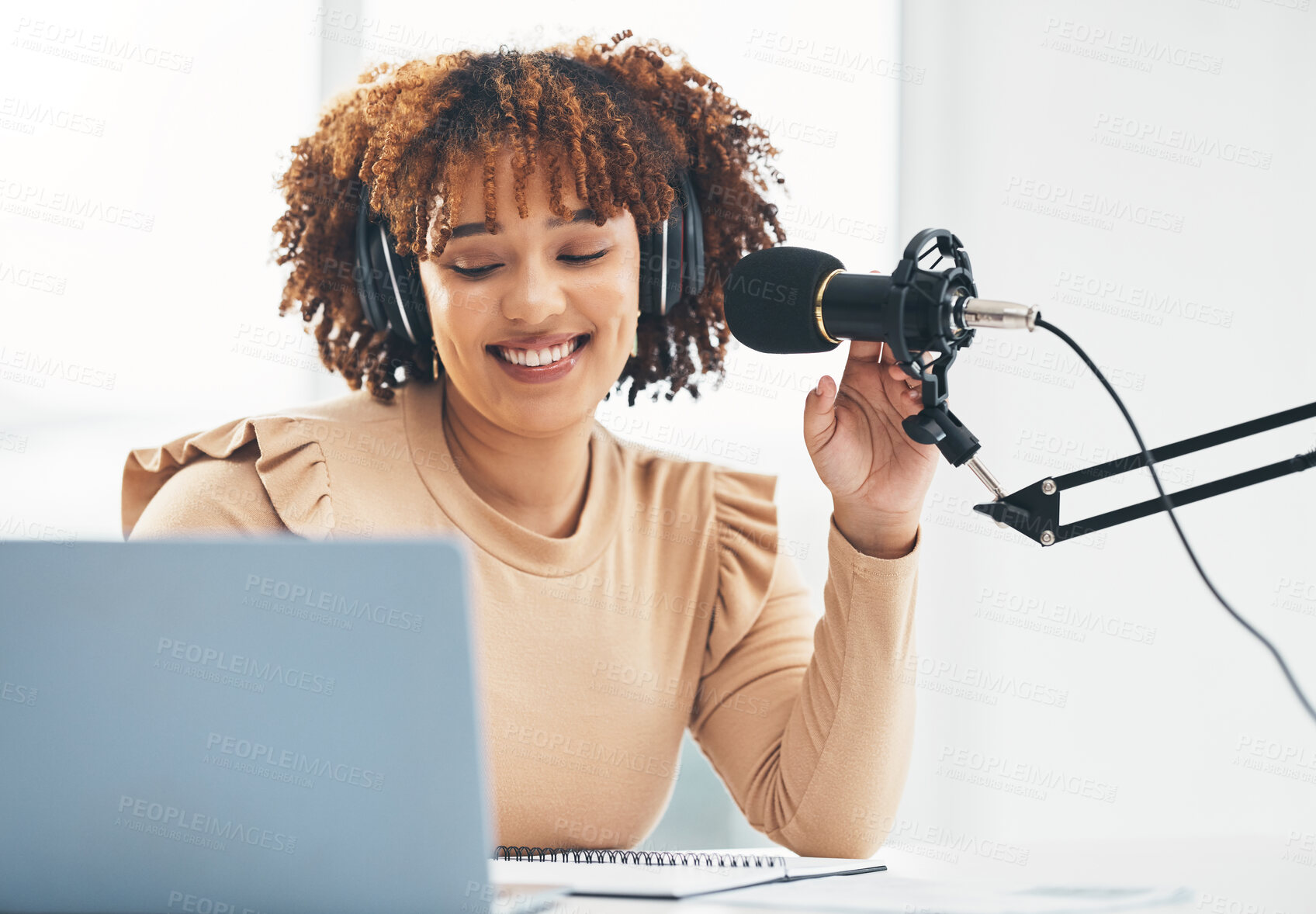 Buy stock photo Laptop, microphone and media with a black woman presenter talking during a broadcast while live streaming. Influencer, talk show and radio with a female journalist or host chatting on a mic