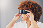 Futuristic, glasses and black woman isolated on a gray background for metaverse, cyberpunk and virtual reality. VR sunglasses, digital software and vision of gen z model or person thinking of future