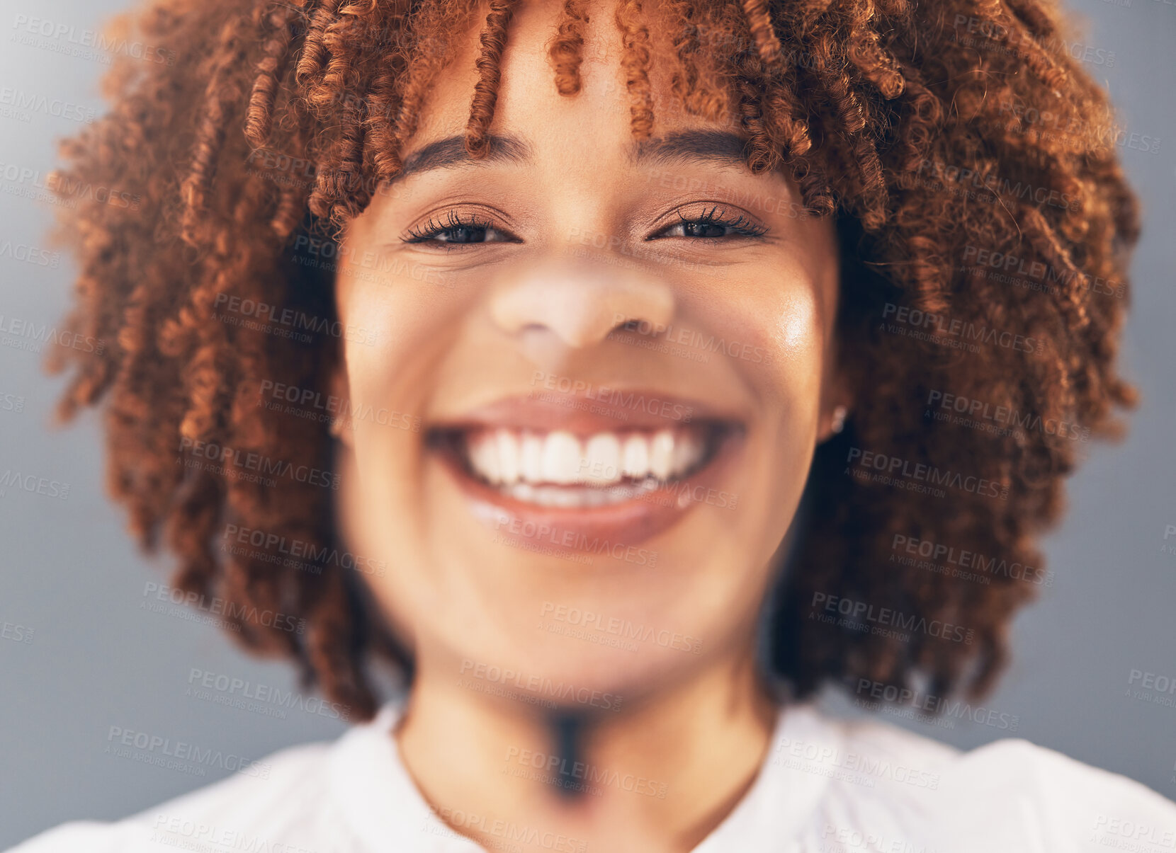 Buy stock photo Happy, portrait and woman model with magnifying glass in studio for over her face, mouth and teeth. Dental, healthcare and young African female with a smile in zoom or magnifier by gray background