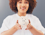 Finance, piggy bank or black woman with savings budget or financial profits growth on blurred background. Happy, portrait or African American girl with financial tin for cash loan or money investment