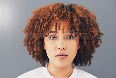 Buy stock photo Beauty, afro and black woman face or activist for empowerment and looking serious, confident and proud. Portrait, head and African American female with curly hair isolated in gray background