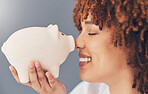 Smile, piggy bank or happy black woman with savings budget or financial profits growth on studio background. Face, finance or African girl holding financial tin for cash loan or money investment 