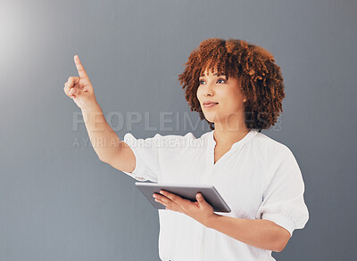Buy stock photo Tablet, pointing and business woman in studio isolated on gray background controlling user interface. Technology, social media and black female entrepreneur with digital touchscreen for web browsing.