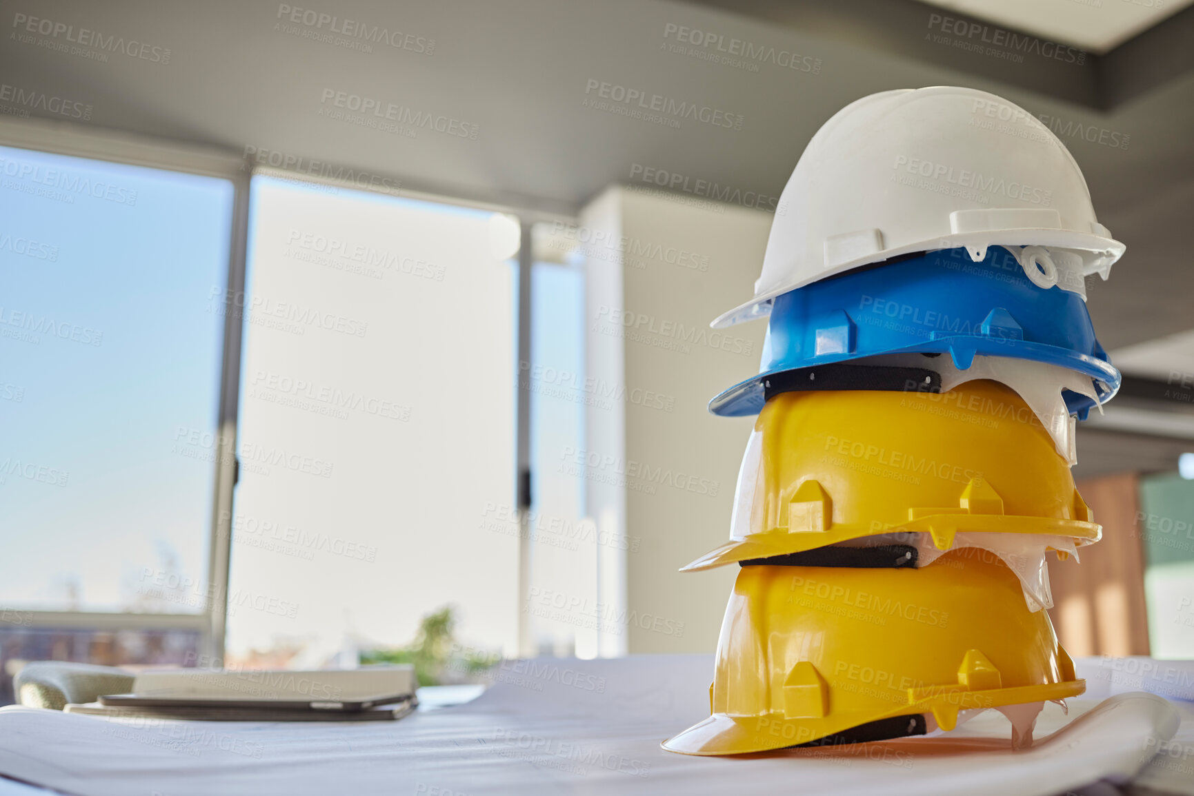 Buy stock photo Building, helmets and architect equipment on table for construction safety, security or industrial work gear at office. Stack of hard hats on desk for safe engineering or contracting for architecture