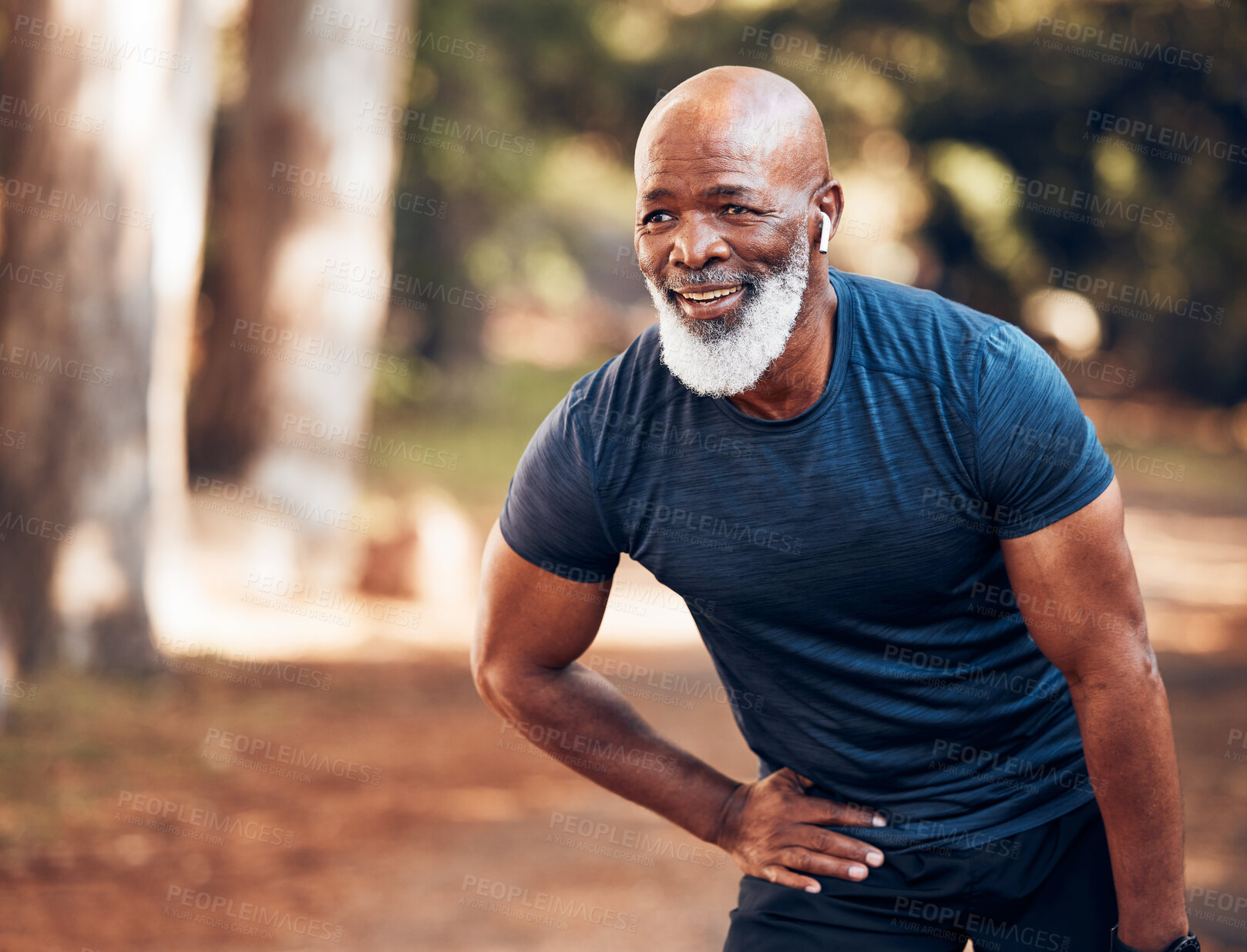 Buy stock photo Black man, break from running and relax with fitness, vitality and cardio, senior runner in the park. Exercise, earpods and listen to music for motivation, tired with endurance and health outdoor