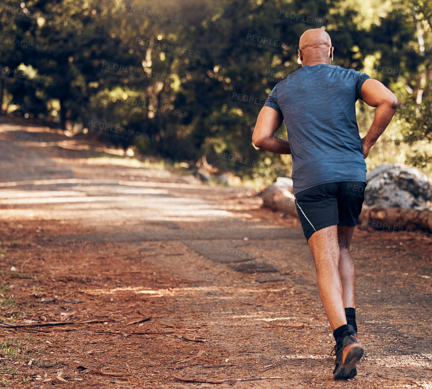 Buy stock photo Back, black man and sports running in park, nature and forest for workout, training or exercise mockup. Sports male, runner and behind of outdoor fitness for energy, health or wellness on garden path