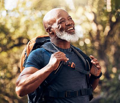 Buy stock photo Nature, fitness and black man hiking with a backpack in a forest for exercise, health and wellness. Sports, athlete and happy senior African male hiker trekking in the woods on an adventure trail.