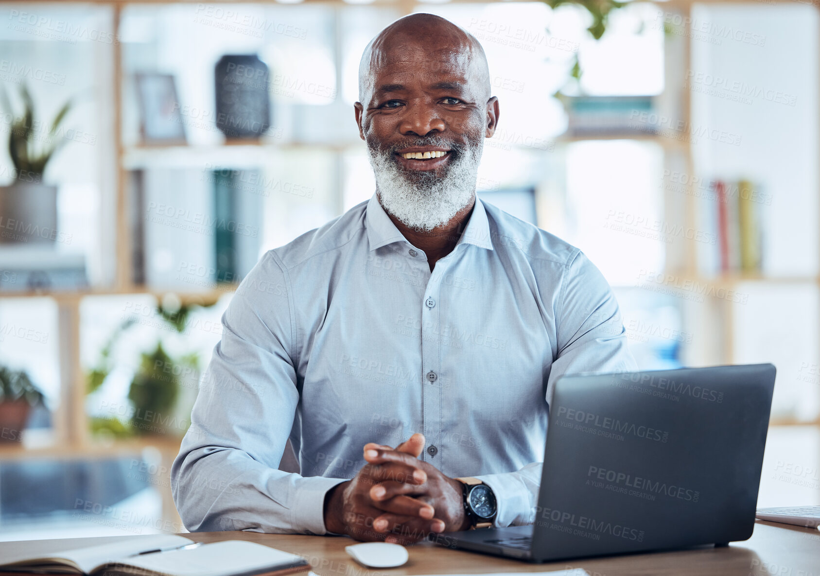 Buy stock photo Senior black man, laptop and portrait smile for business leadership, management or Human Resources at office. Happy African American male corporate CEO or HR smiling and sitting by computer desk