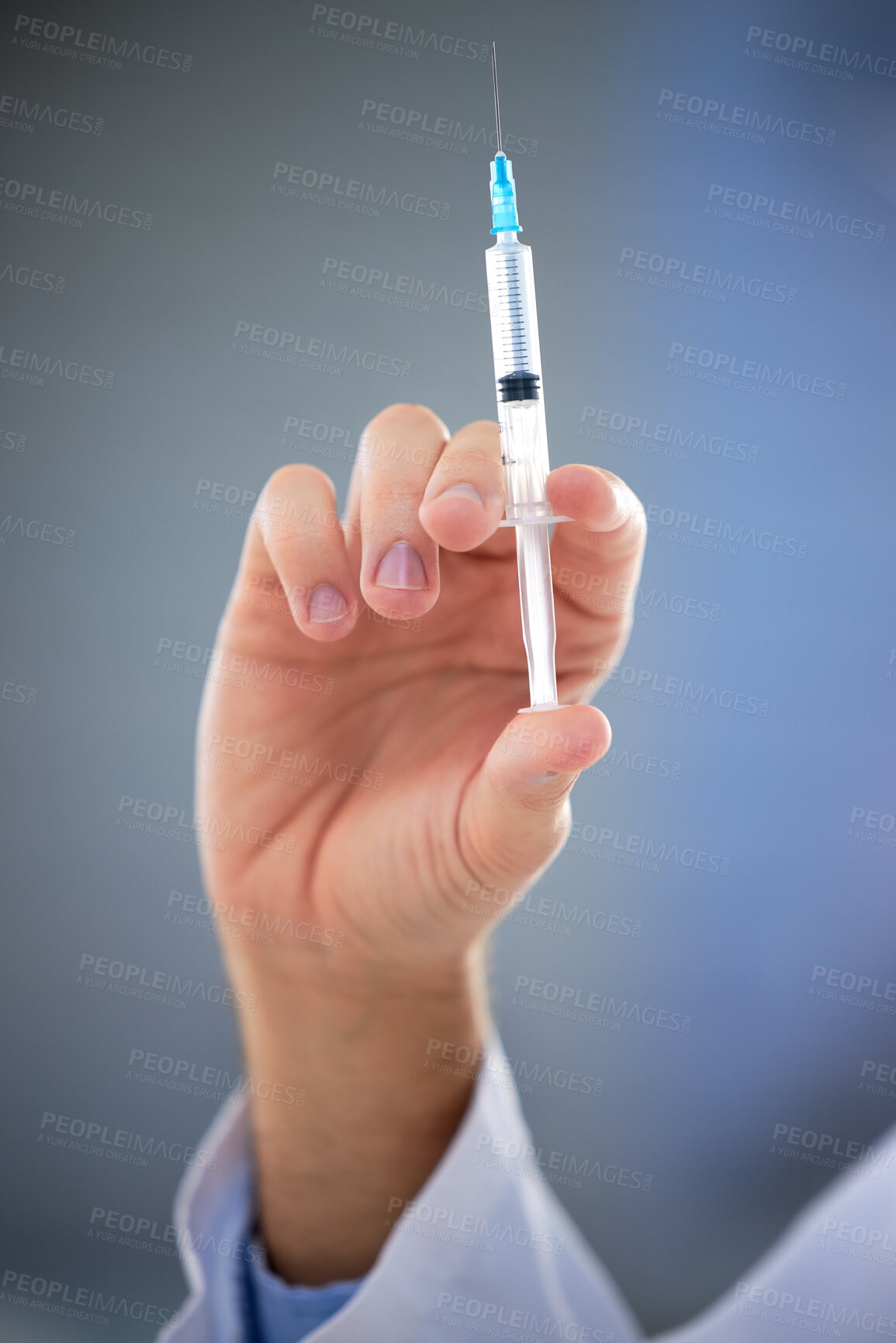 Buy stock photo Hand, healthcare and closeup of needle, vaccine or shot for covid, disease or sickness on mockup. Doctor, syringe and zoom on science, innovation or medicine, cure or medical breakthrough at hospital