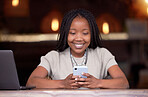 Black woman, phone and smile for social media, chatting or communication and texting at cafe. Happy African American female freelancer smiling for wifi on mobile app, browsing or chat on smartphone