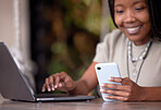 Black woman, phone and laptop in remote work for communication, social media or chatting at cafe. Hands of happy African American female freelancer with smile working on computer and smartphone