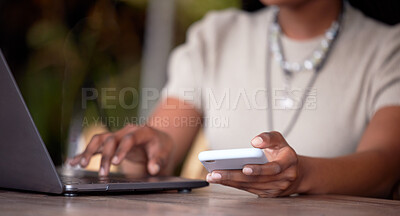 Buy stock photo Black woman, hands and laptop with phone for communication, social media or chatting on table. Hand of African American female freelancer in remote work on computer and smartphone in multitasking