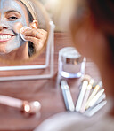 Makeup, mirror and woman cleaning cosmetic product on face as self care, skincare and facial for beauty in a home. Skin, treatment and morning routine with a swab, cotton pad and clay mask for detox