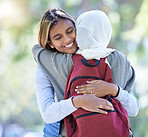 Muslim students, backpack or hug in park, garden or school campus for bonding, friends acceptance or community support. Smile, happy or Islamic women in embrace, fashion hijab or university college
