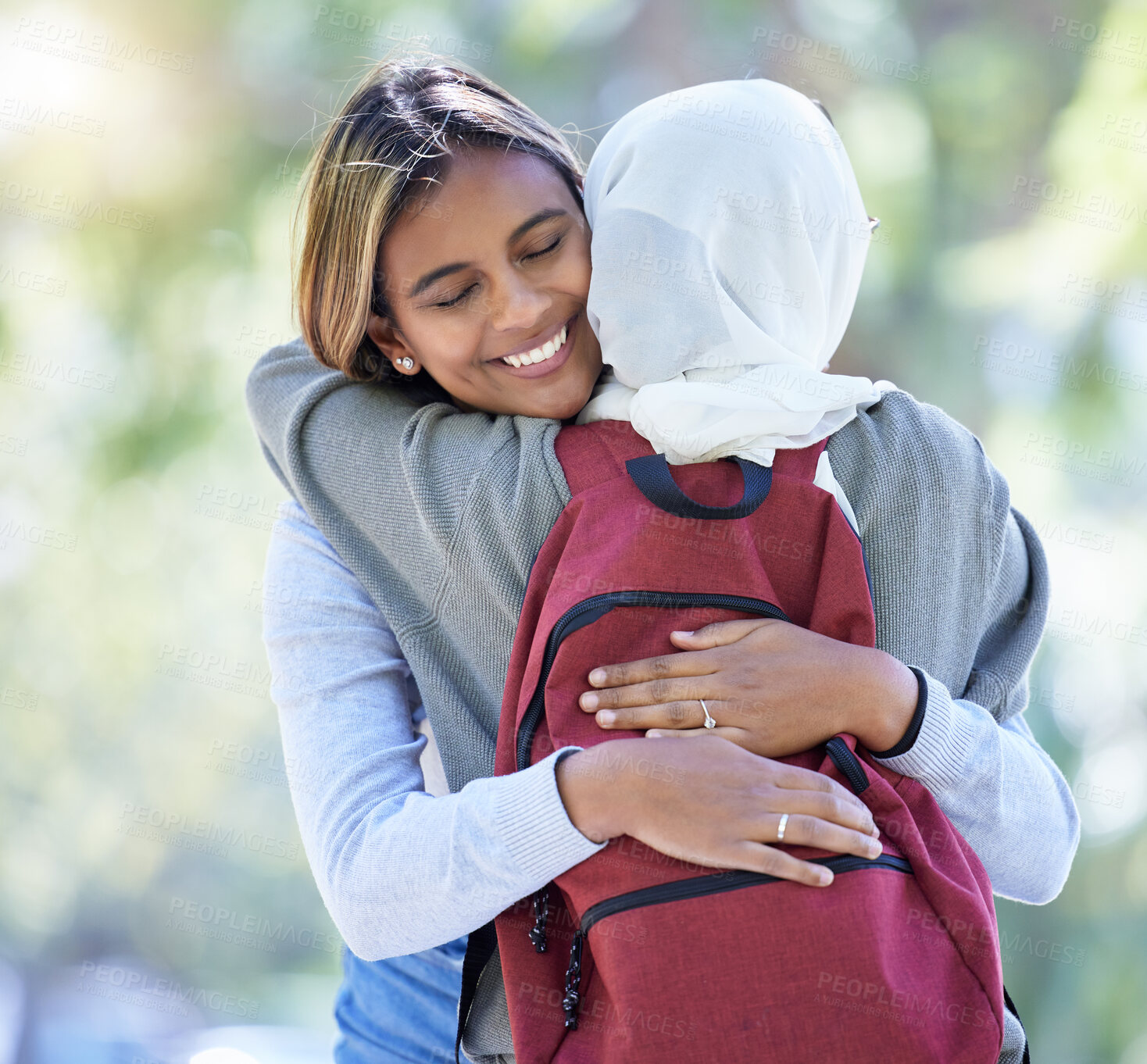 Buy stock photo Happy muslim students, park or hug with backpack in garden or school campus bonding, friends acceptance or community support. Smile, Islamic or women in embrace, fashion hijab or university college