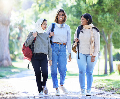 Buy stock photo Islamic women, friends or diversity in park, garden or school campus for bonding break, social gathering or community. Smile, happy or Muslim students walking in university college or fashion hijab