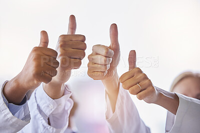 Buy stock photo Doctor, group thumbs up and teamwork with hands, celebration and motivation in hospital for healthcare. Man, woman and medic team building with support, solidarity and diversity in clinic workplace