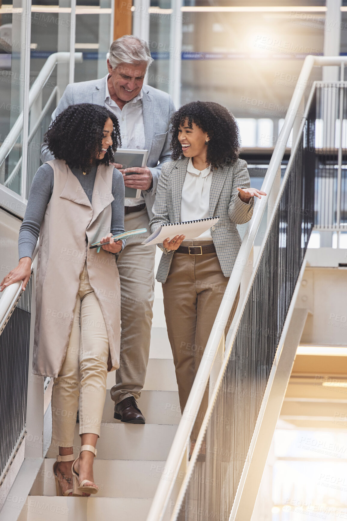 Buy stock photo Meeting, walking in office and business people on stairs in discussion for planning, strategy and chatting at work. Teamwork, corporate workplace and happy workers with notebook, documents and report