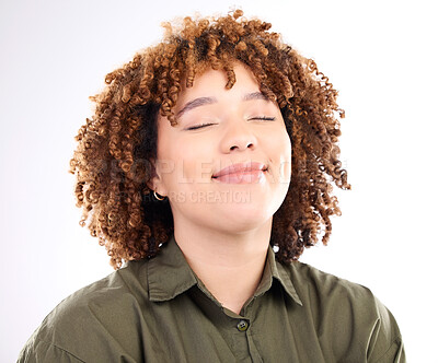 Buy stock photo Face, content and peaceful with a black woman in studio isolated on a white background for quiet. Eyes closed, freedom and calm with an attractive young female posing to promote wellness or zen