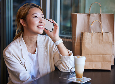 Buy stock photo Phone call, shopping mall and Asian woman in cafe with coffee talking, chatting and in conversation. Communication, fashion and happy girl on mockup smartphone for discount news, retail deal and sale