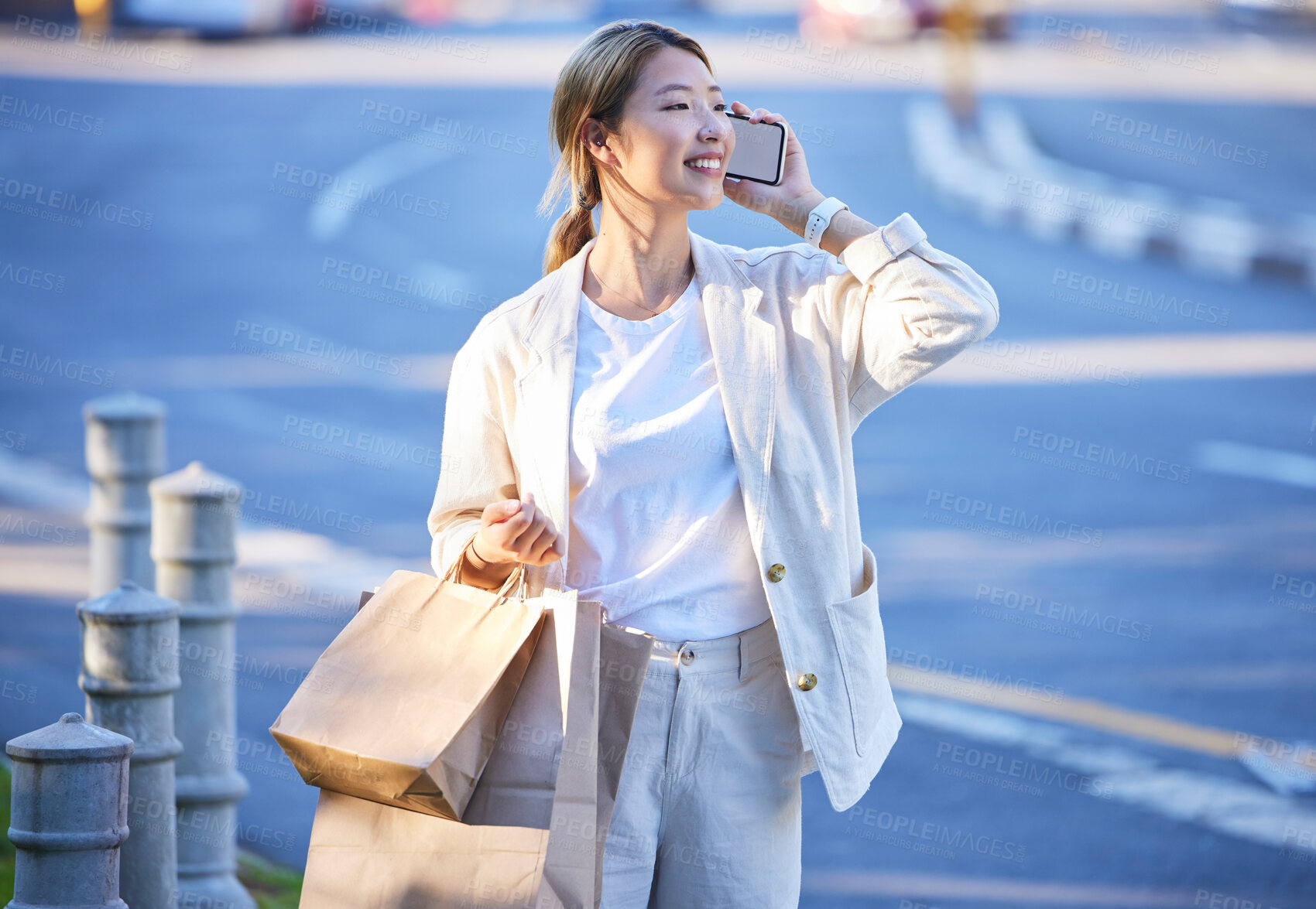 Buy stock photo Phone call, shopping bag and Asian woman with mobile mockup screen by a city street. Retail customer, conversation and happiness of a young person with paper bags from shop sale or store discount