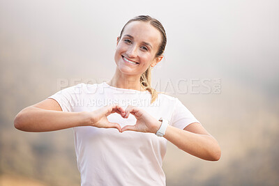 Buy stock photo Portrait, runner and hand sign by woman with heart, symbol or gesture for wellness against blurred background. Face, happy and girl with emoji hands, shape and message for self love, peace and care