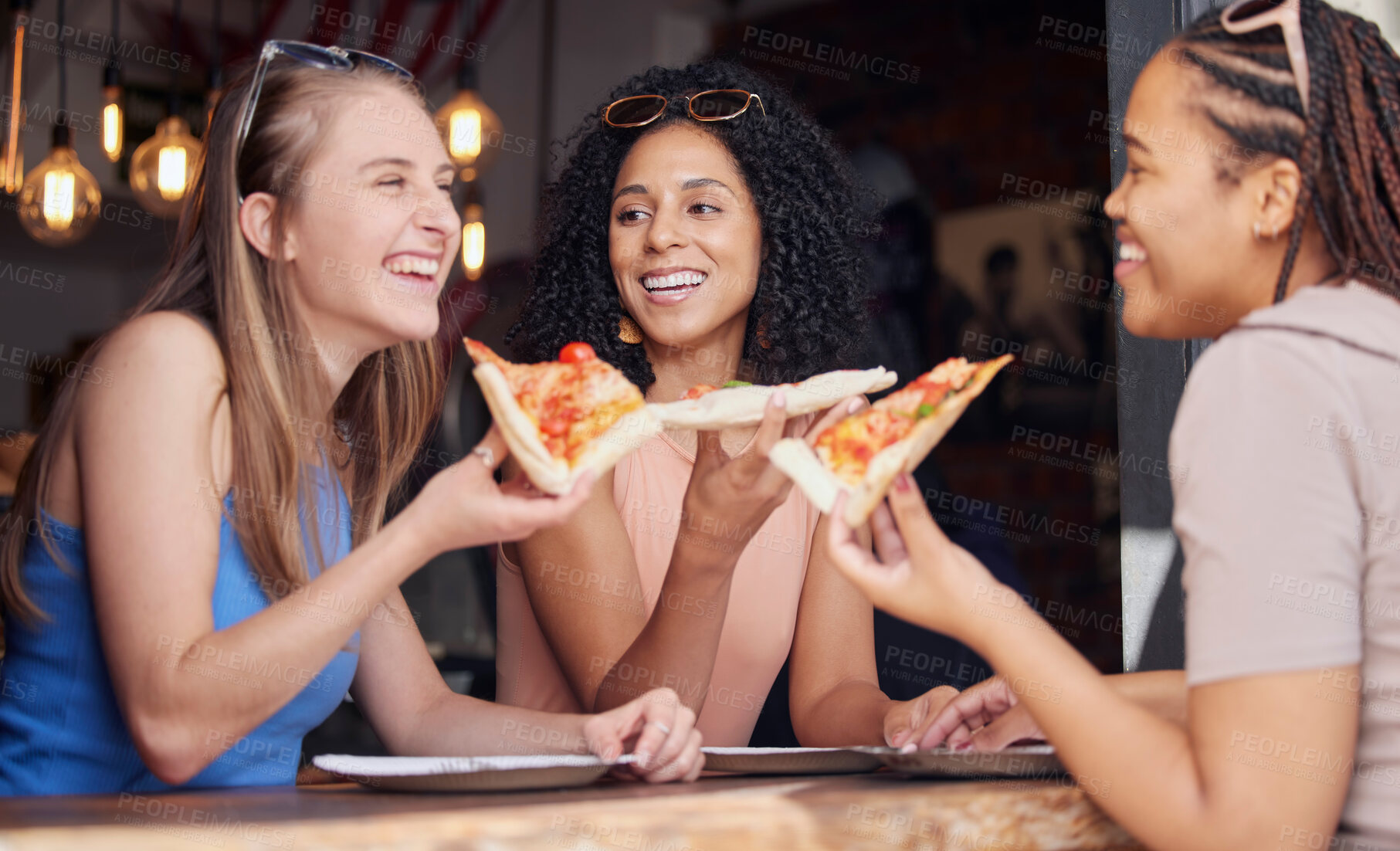 Buy stock photo Woman, friends and laughing with pizza for funny joke, meme or conversation together at restaurant. Happy hungry women laugh and smile for fun date, eating or bonding at cafe enjoying Italian food