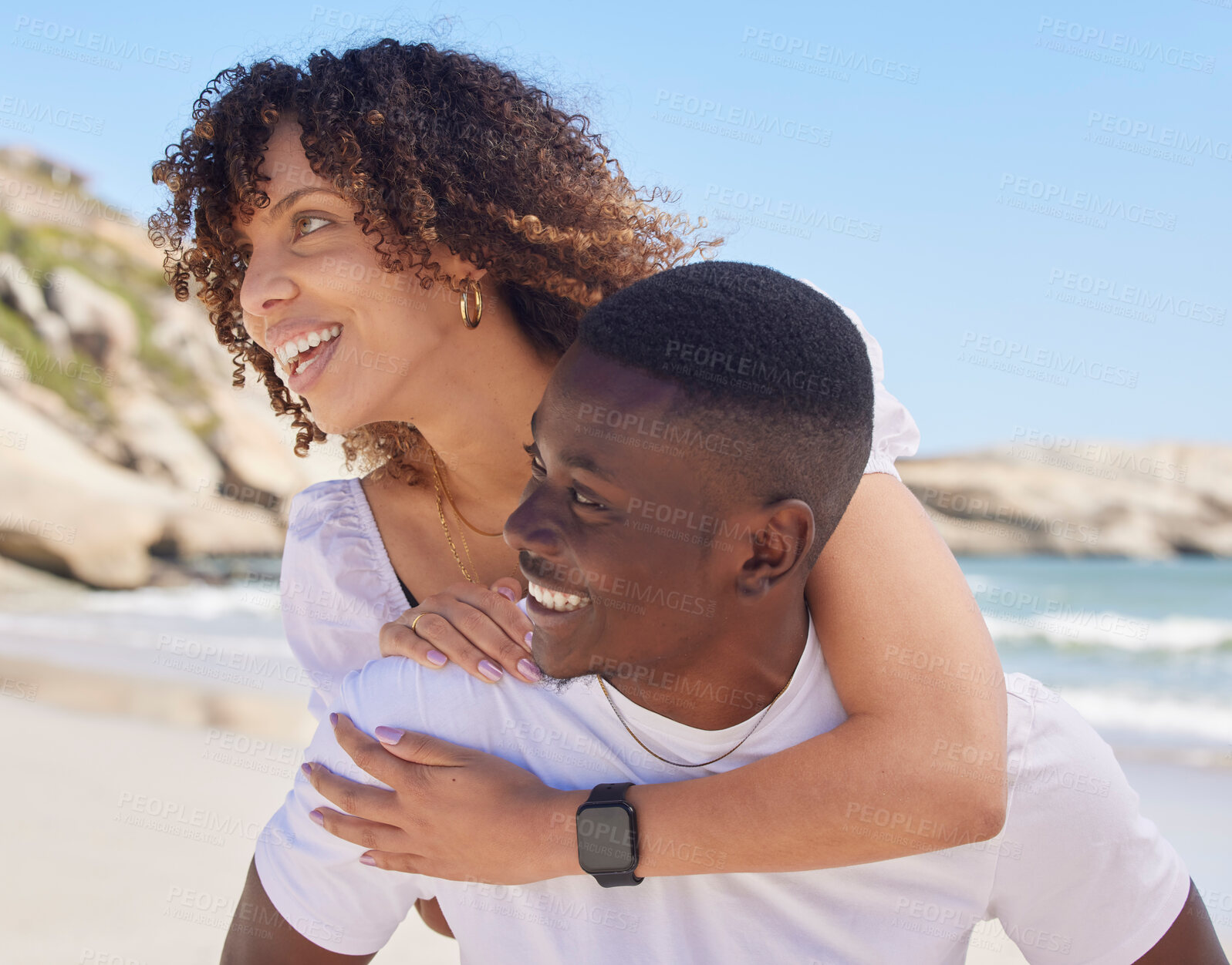 Buy stock photo Love, piggy back and couple on beach, smile and romantic on summer vacation, break and wellness. Romance, black man carry woman and happiness on seaside holiday, weekend and loving together and relax