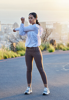 Buy stock photo Fitness, arm and stretching by woman in road for running, training and exercise at sunset, body or warm up. Runner, stretch and mindset by girl at sunrise for cardio, marathon or outdoor practice run