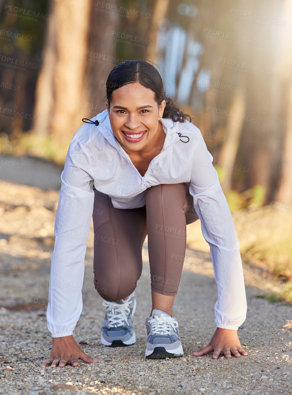 Buy stock photo Fitness, nature or runner ready to start running workout, sports exercise or cardio training outdoors. Wellness, forest or happy girl with commitment, resilience or motivation for exercising in race