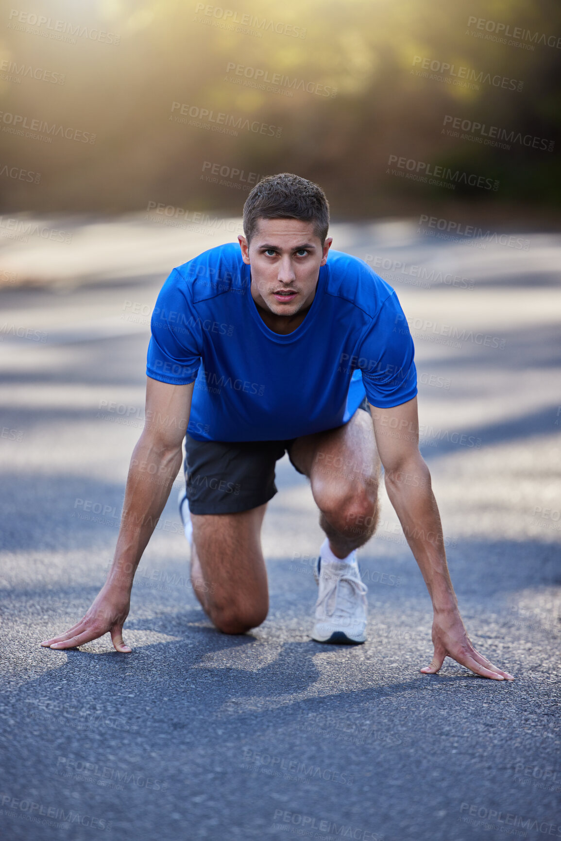 Buy stock photo Running start, street and exercise of a man doing race training, workout and sport outdoor. Focus, wellness and health of a sprinter on the road for fitness, sports and athlete cardio ready to go