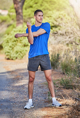 Buy stock photo Stretching arms, fitness and man in nature getting ready for running, exercise or training. Sports health, thinking and male athlete warm up or prepare to start cardio, exercising or jog for wellness