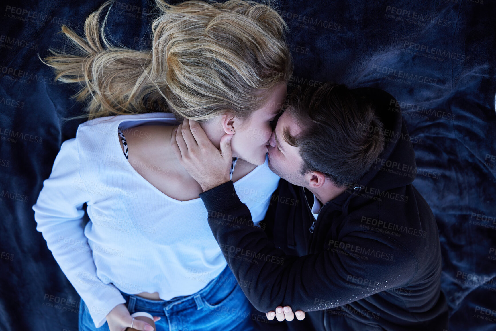 Buy stock photo Kiss, above and a couple with romance on a date, anniversary or valentines day. Love, embrace and loving man and woman romantic kissing in a relationship, on a honeymoon or relations together