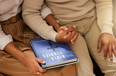 Buy stock photo Love, bible and couple holding hands, studying and support with religious practice, teaching and growth for marriage. Holy text, man and woman bonding, scripture and prayer with connection or healing