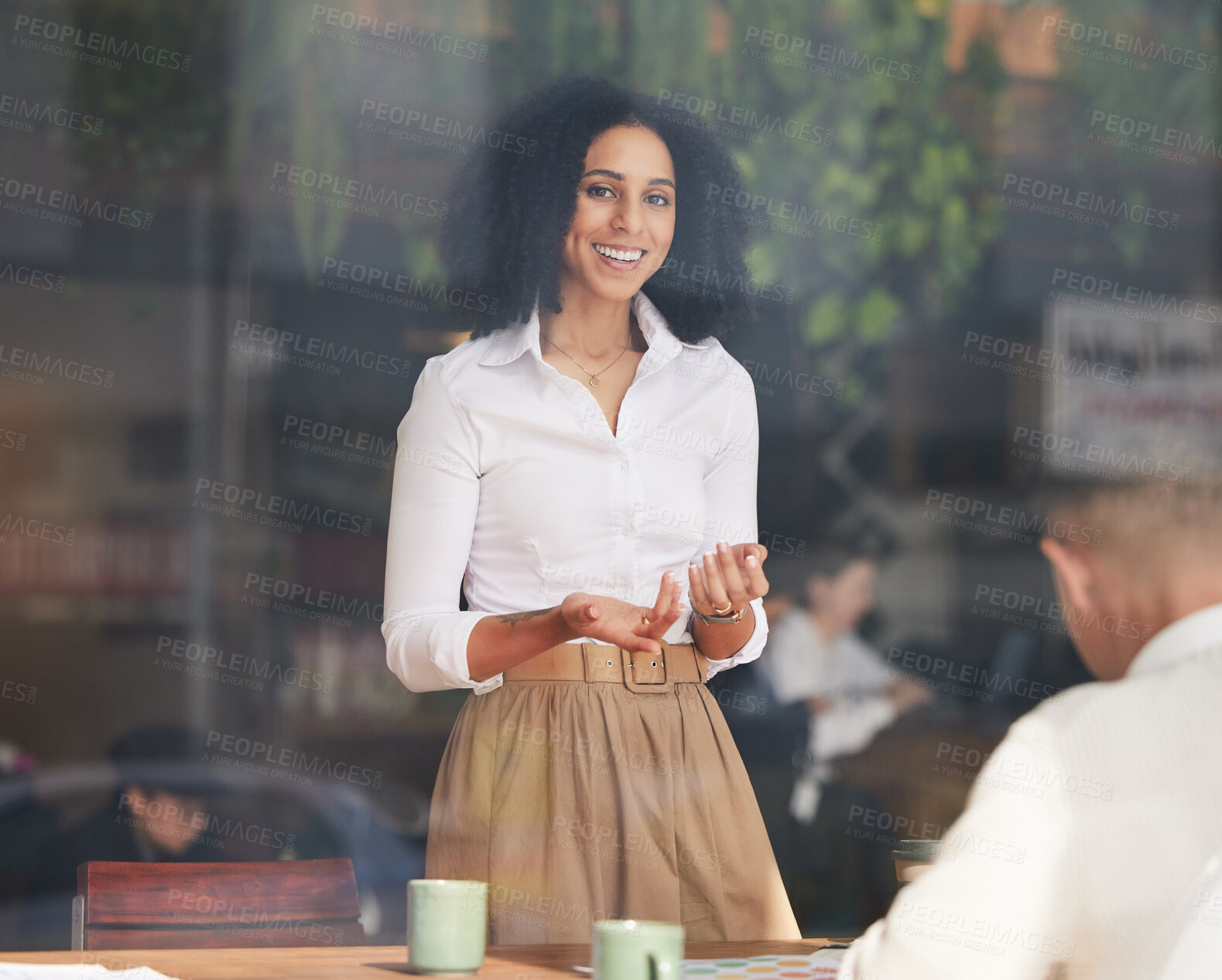 Buy stock photo Portrait, meeting and presentation with a business black woman talking to her team through an office window. Training, coaching and agenda with a female employee talking to an employee group at work