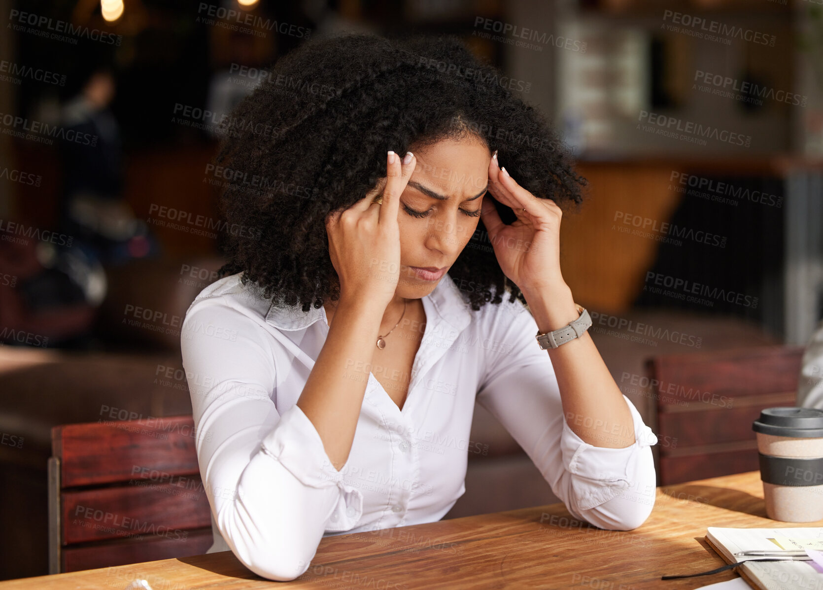 Buy stock photo Business stress, headache and black woman in coffee shop feeling pain, migraine or tired. Mental health, anxiety and remote worker or female employee with depression, burnout or fatigue in restaurant