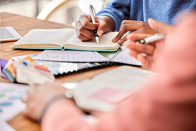 Buy stock photo Meeting, planning and team writing notes while in discussion on a creative project in the office. Collaboration, teamwork and people brainstorming with notebooks while working on report in workplace.