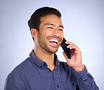 Phone call, good news or laughter with man in studio on a gray background talking for communication. Mobile, contact and calling with a handsome young male against a wall for chatting or conversation