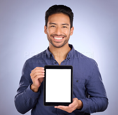 Buy stock photo Business asian man, tablet and smile with mockup for social media, advertising or marketing app against studio background. Portrait of happy male smiling with touchscreen for copy space advertisement