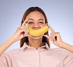 Woman, banana and smile portrait in studio for healthy food, vegan diet and fruit in hands. Face of a happy black person model with fruits for health, wellness and nutrition on purple background