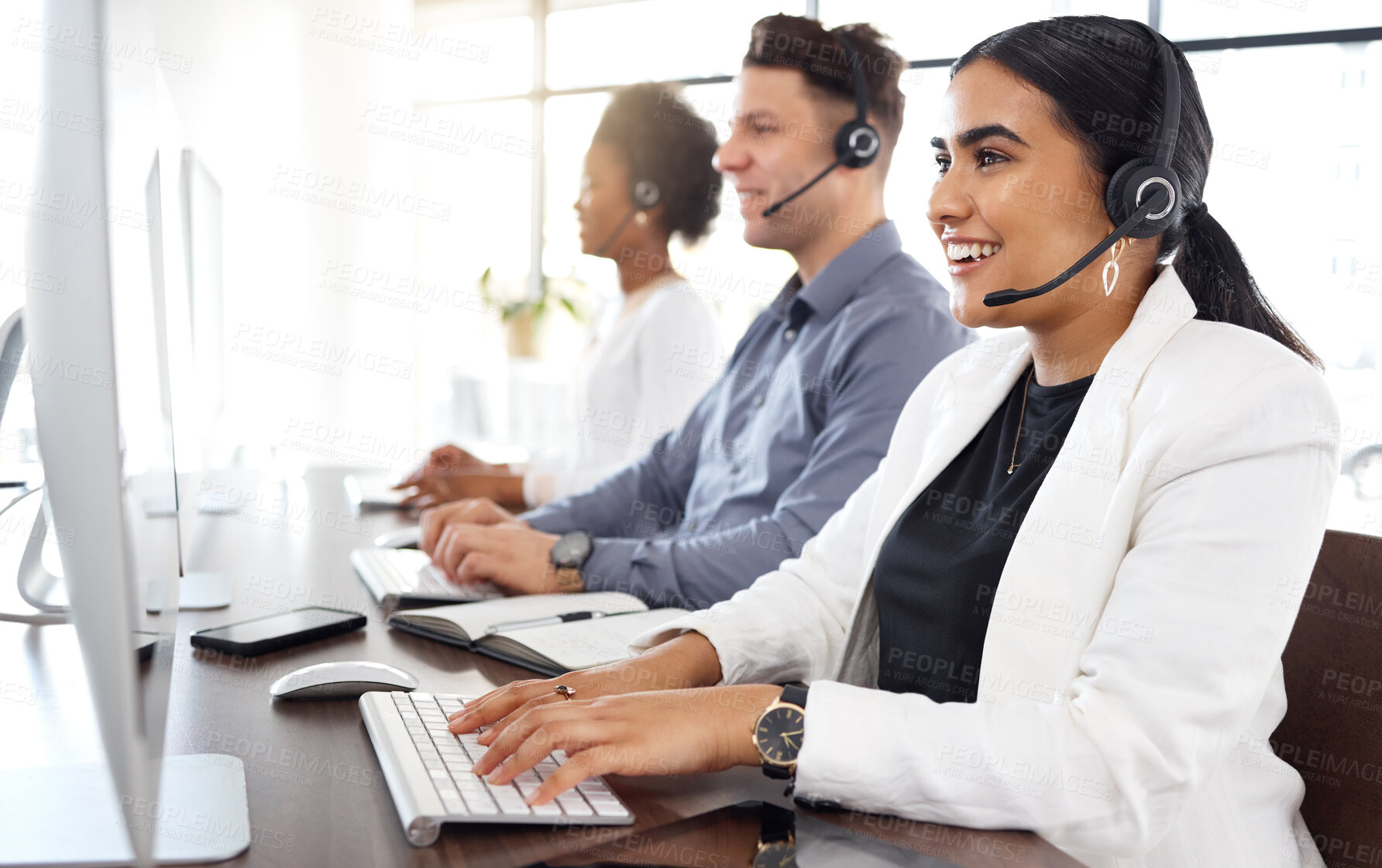 Buy stock photo Woman, call center and computer typing and consulting in telemarketing, customer service or support at office. Happy female consultant talking on mic sitting by desktop PC in contact us for sales