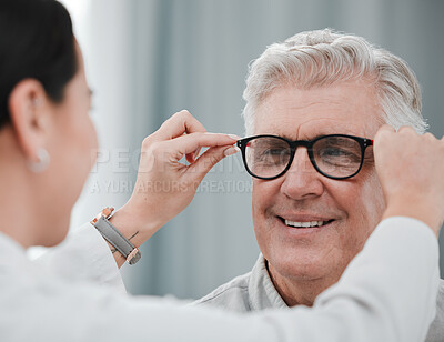 Buy stock photo Optometry, ophthalmology and optometrist fitting glasses on senior man patient or happy client during appointment. Doctor, consultation and eyewear or spectacles for an elderly male for vision