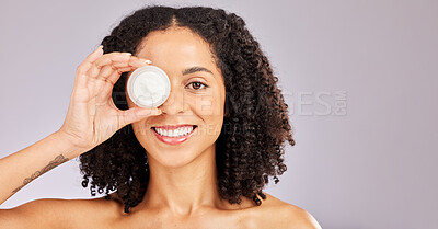 Buy stock photo Face, skincare and black woman with cream container in studio isolated on a gray background. Dermatology portrait, cosmetics and happy female model with lotion, creme or moisturizer for skin health.