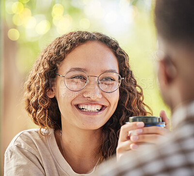 Buy stock photo Face, smile or date and a black woman drinking coffee in the park with her boyfriend during summer. Happy, love and dating with a young female smiling at her partner for romance or affection