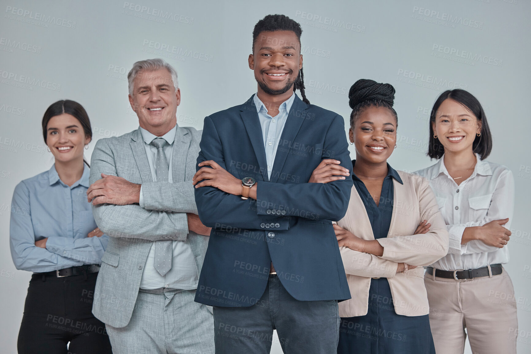 Buy stock photo Leadership, team and business people with crossed arms in a studio with confidence, unity and teamwork. Collaboration, corporate and portrait of a group of employees standing by a gray background.