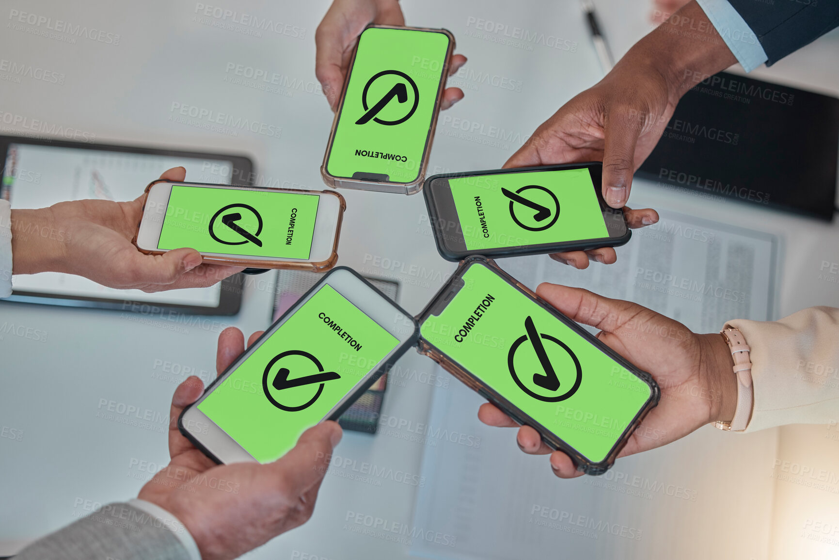 Buy stock photo Business people, hands and phone with tick in networking, teamwork planning or sharing information. Hand of group above showing smartphone display in completion for tasks, mobile app or data syncing