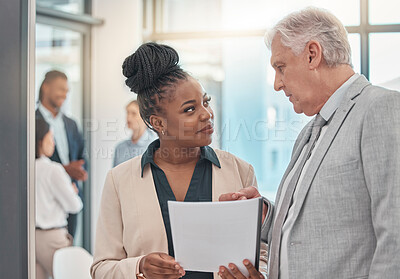Buy stock photo Documents, discussion and man and black woman talking in office for business proposal, strategy or advice. Collaboration, teamwork and corporate managers meeting for project, report or finance review